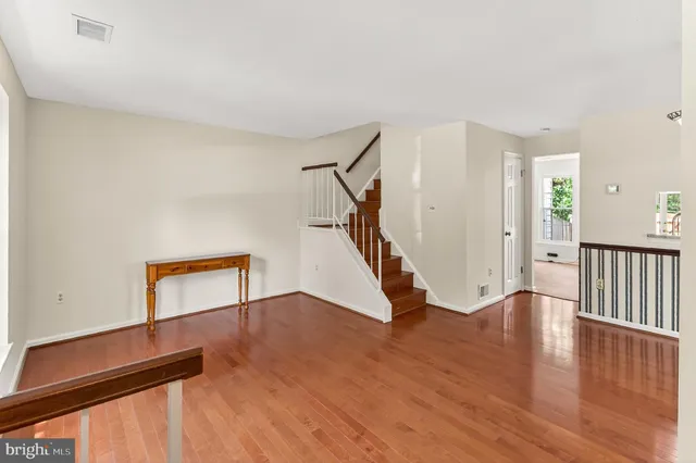 a view of an entryway with wooden floor