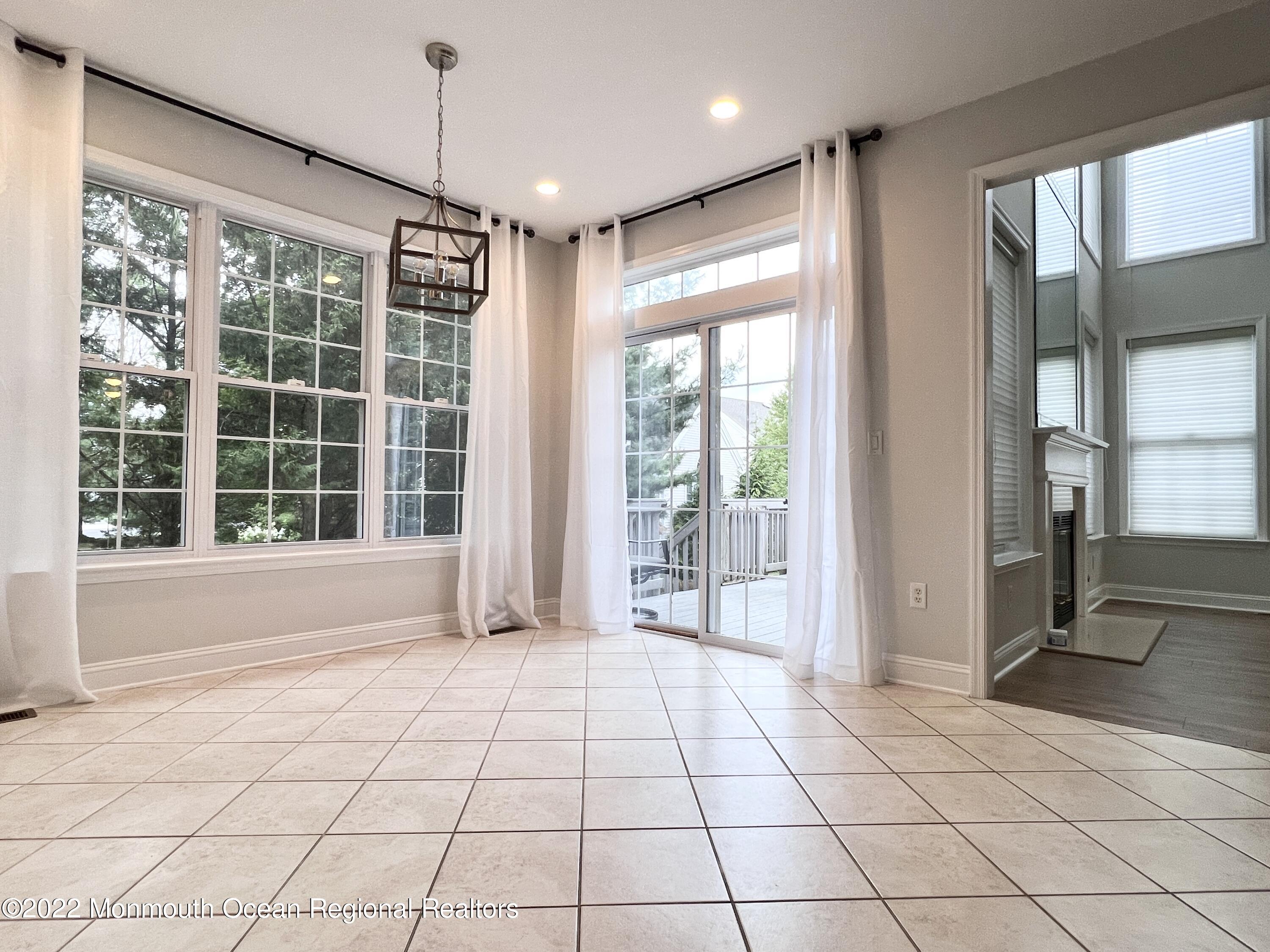 1 Hendrickson Court Manalapan, NJ 07726 - Photo 18 of 39 a view of an empty room with a window