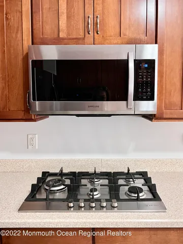 a view of kitchen with sink and window