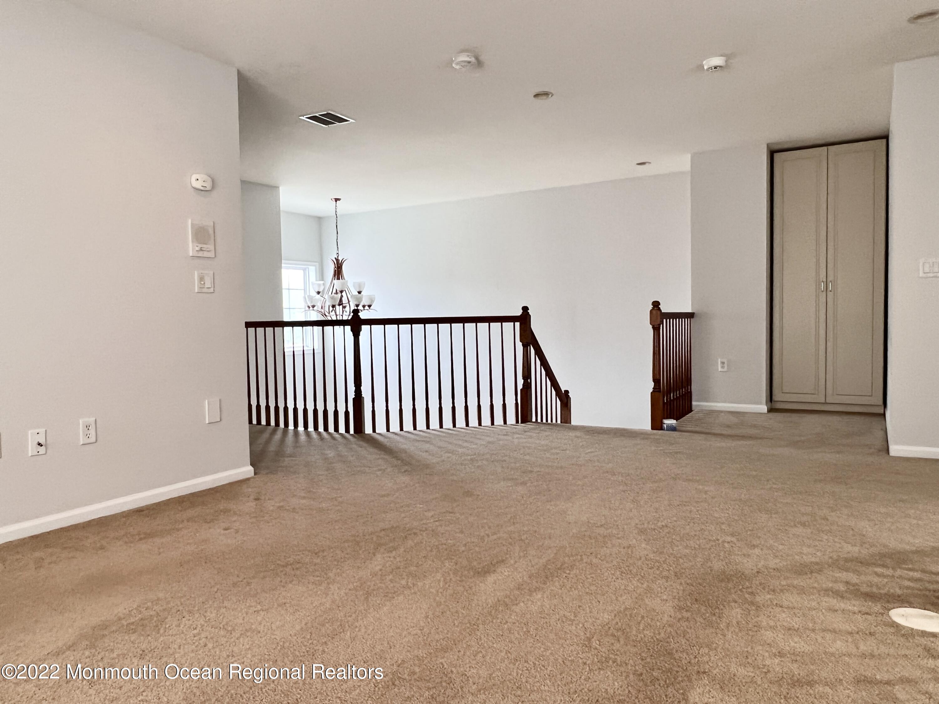 1 Hendrickson Court Manalapan, NJ 07726 - Photo 23 of 39 a view of a room with stairs