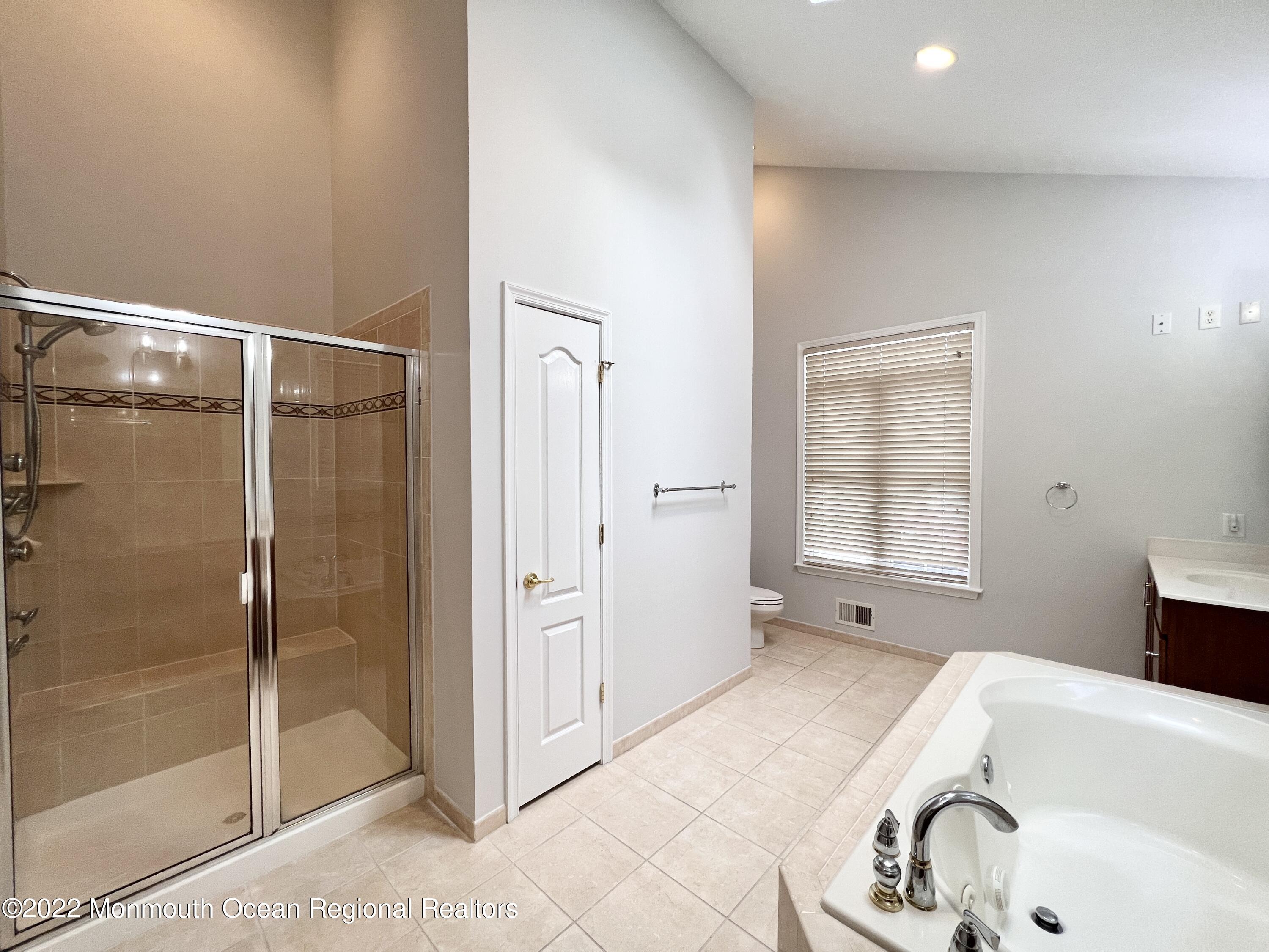 1 Hendrickson Court Manalapan, NJ 07726 - Photo 30 of 39 a bathroom with a tub and shower