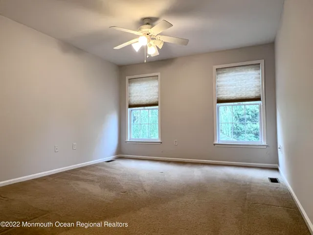 an empty room with a empty space and a window