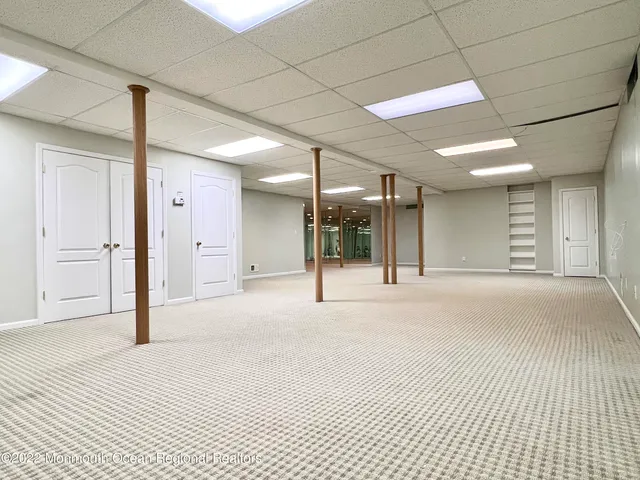 a view of a hall with a floor to ceiling window