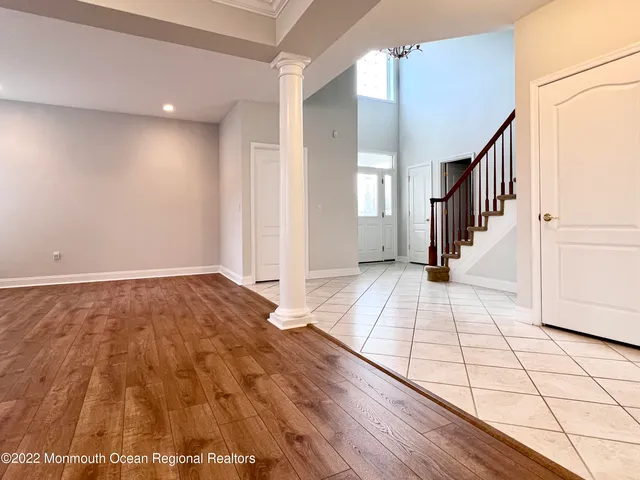 a view of an entryway with wooden floor