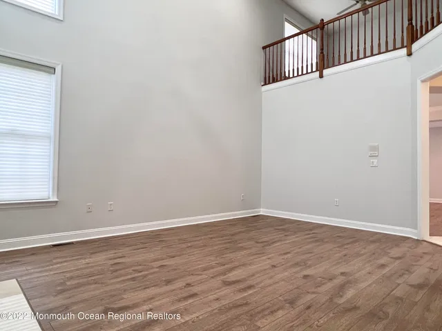 an empty room with wooden floor