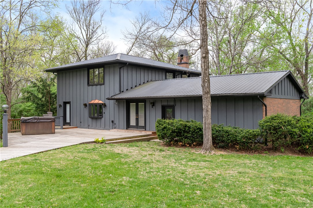 6750 Little Twin Road Germantown, OH 45327 - Photo 38 of 88 This modern home features a spacious deck, perfect for entertaining amidst lush greenery.
