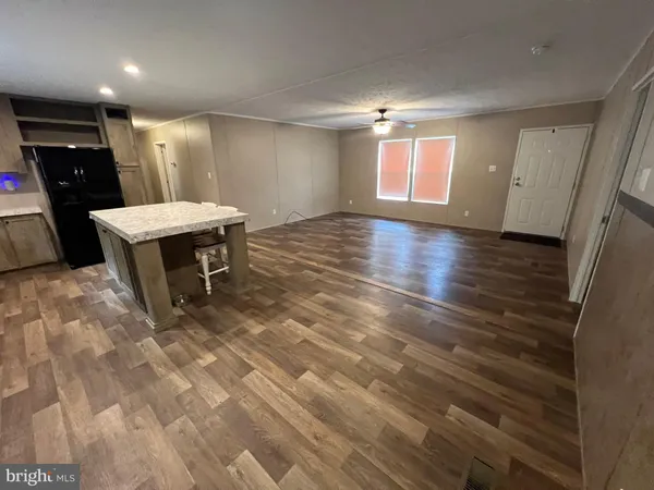 a view of a livingroom with furniture and window
