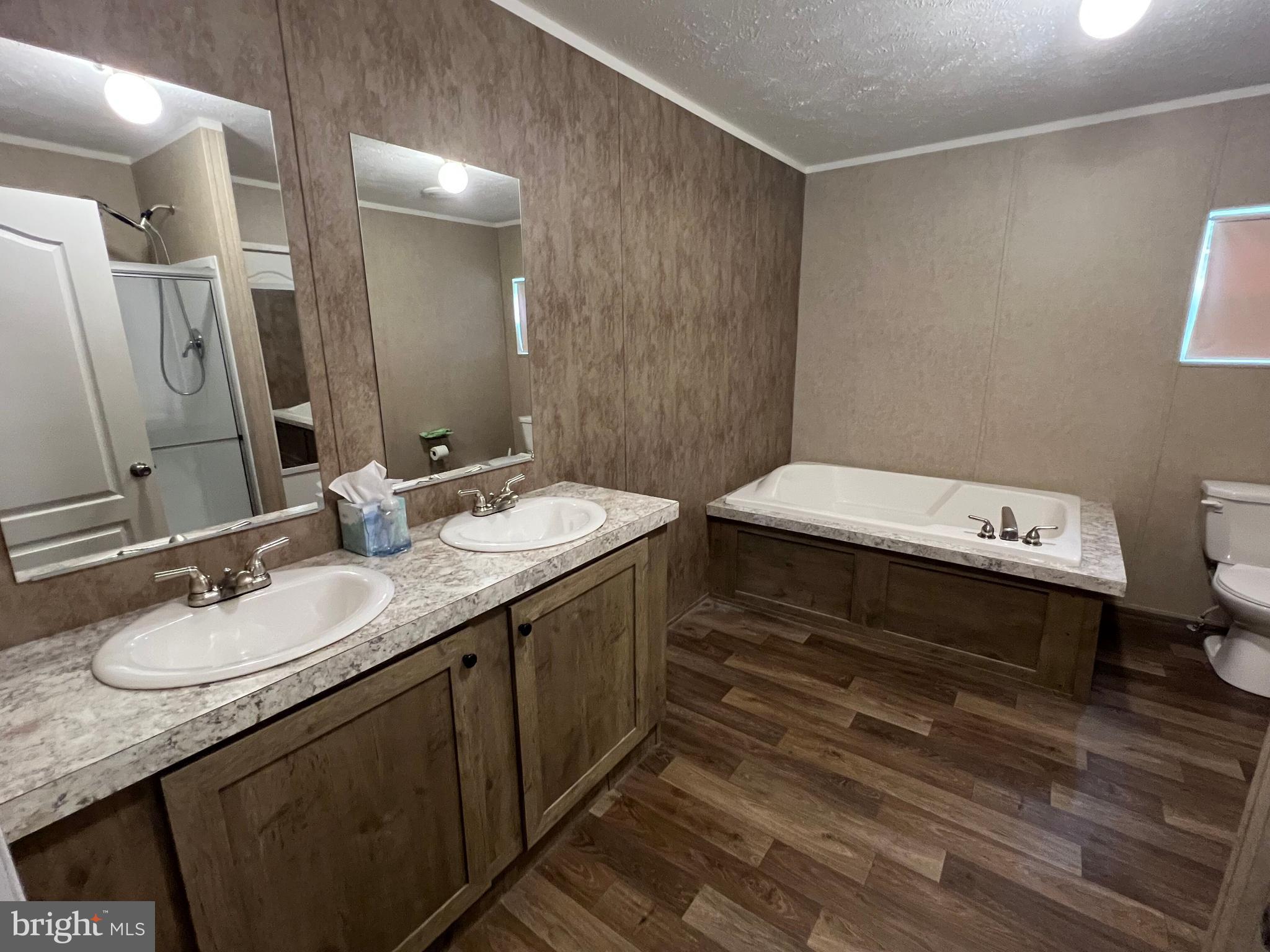 853 Janes Way High View, WV 26808 - Photo 13 of 35 a bathroom with a double vanity sink and a mirror