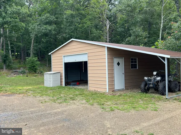 a front view of house with yard and seating area