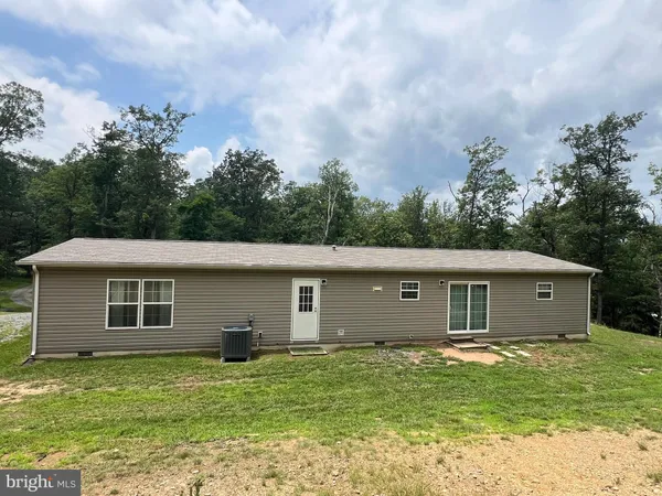 a house view with a backyard space