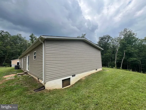 a backyard of a house with lots of green space