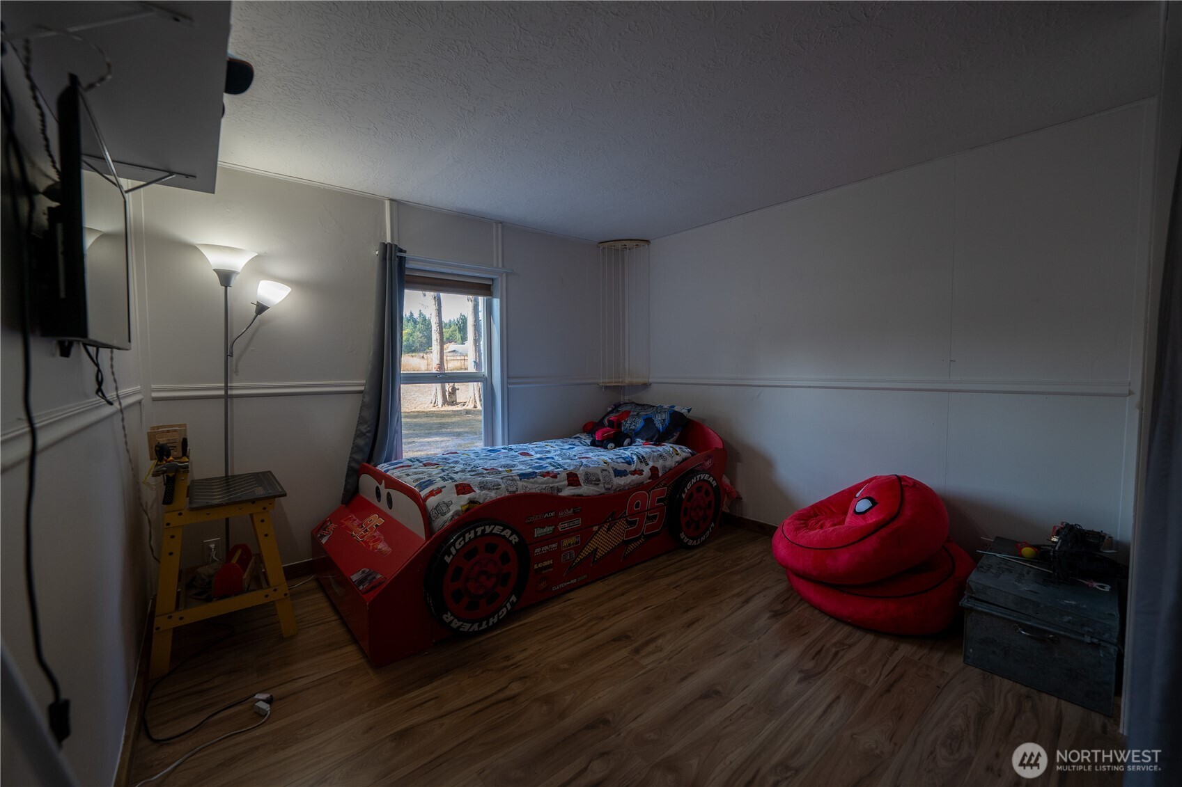 693 John Jacobs Road Port Angeles, WA 98362 - Photo 18 of 30 a bedroom with a bed and a window