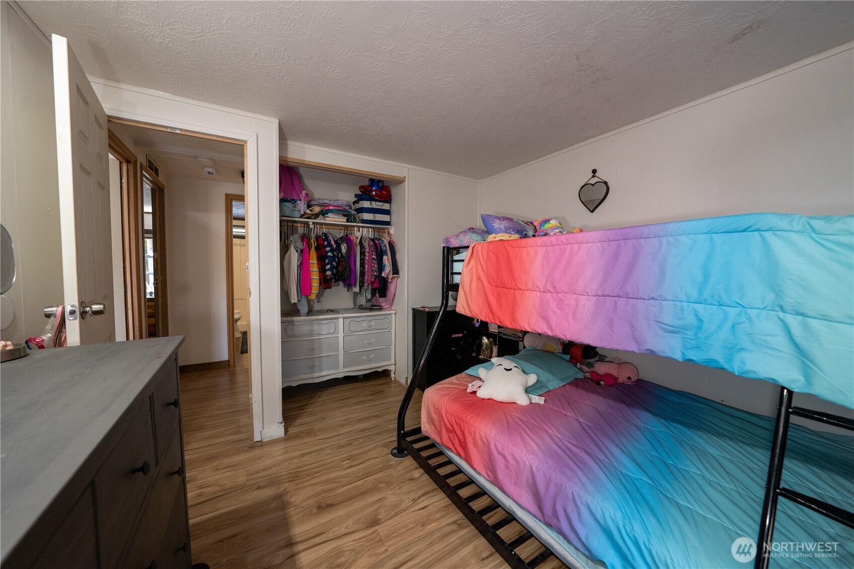 693 John Jacobs Road Port Angeles, WA 98362 - Photo 20 of 30 a bedroom with a bed and a dresser
