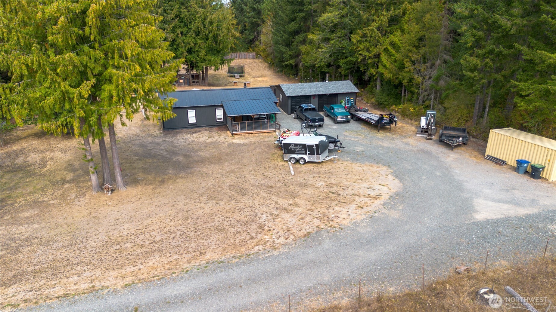 693 John Jacobs Road Port Angeles, WA 98362 - Photo 2 of 30 a backyard of a house with table and chairs