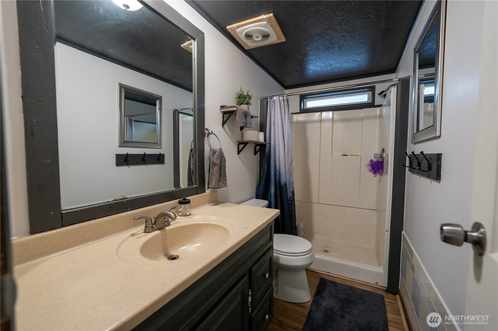 693 John Jacobs Road Port Angeles, WA 98362 - Photo 21 of 30 a bathroom with a sink toilet and shower