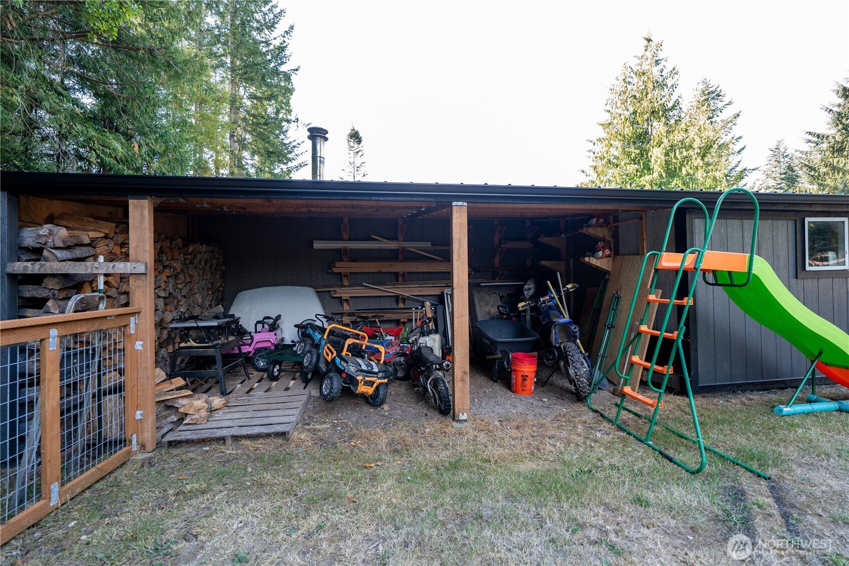 693 John Jacobs Road Port Angeles, WA 98362 - Photo 27 of 30 a view of outdoor space with deck and trees