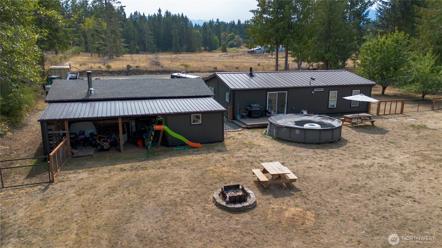 693 John Jacobs Road Port Angeles, WA 98362 - Photo 4 of 30 an outdoor space with furniture and stove
