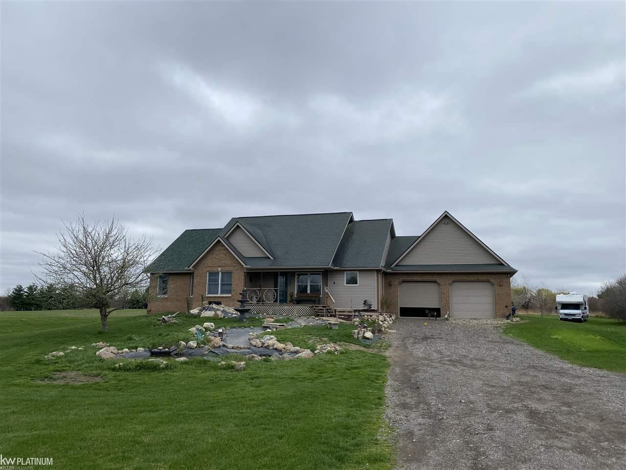 2064 Winslow Road Imlay City, MI 48444 - Photo 55 of 61 Water feature in front of home has a recirculated waterfall. All components were bought and installed 2020. If this is something you are not interested in, the seller will remove it. Or you could fini