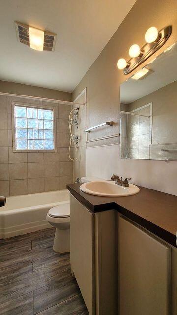 4429 31st Street Lubbock, TX 79410 - Photo 9 of 12 a bathroom with a sink toilet and shower