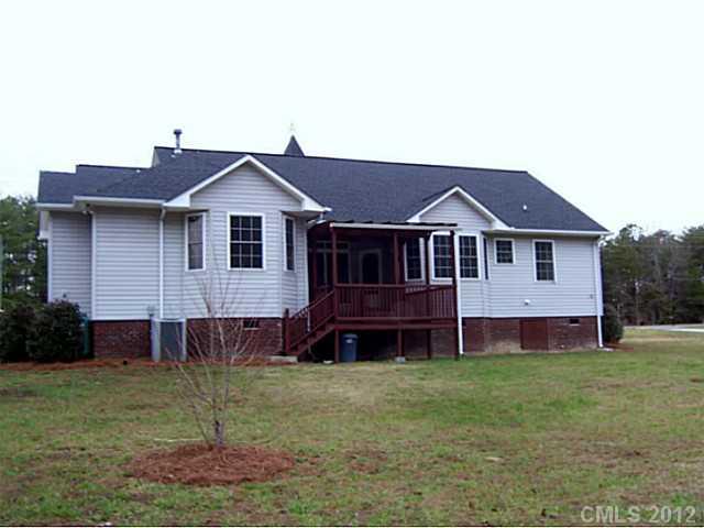 790 Mason Dickson Road York, SC 29745 - Photo 2 of 13 a front view of a house with a garden