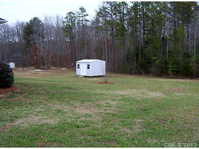 790 Mason Dickson Road York, SC 29745 - Photo 13 of 13 a backyard of a house with lots of green space