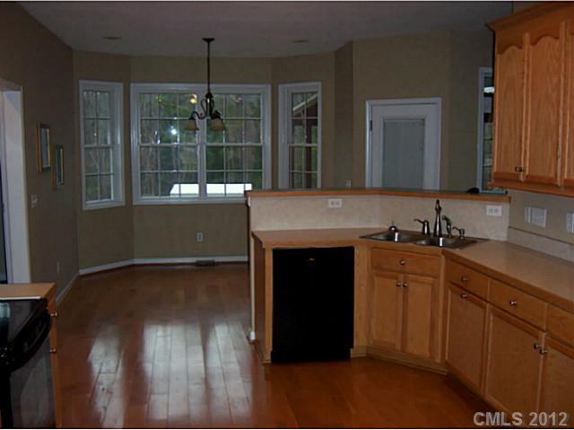 790 Mason Dickson Road York, SC 29745 - Photo 4 of 13 a kitchen with a sink and a wooden floor