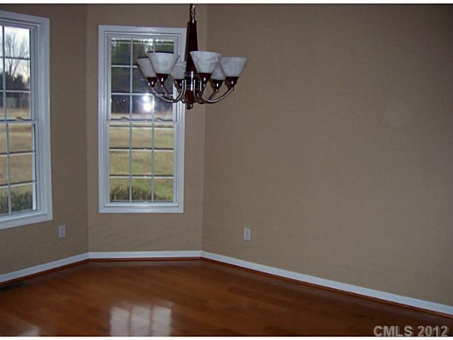 790 Mason Dickson Road York, SC 29745 - Photo 7 of 13 a view of a room with wooden floor and chandelier