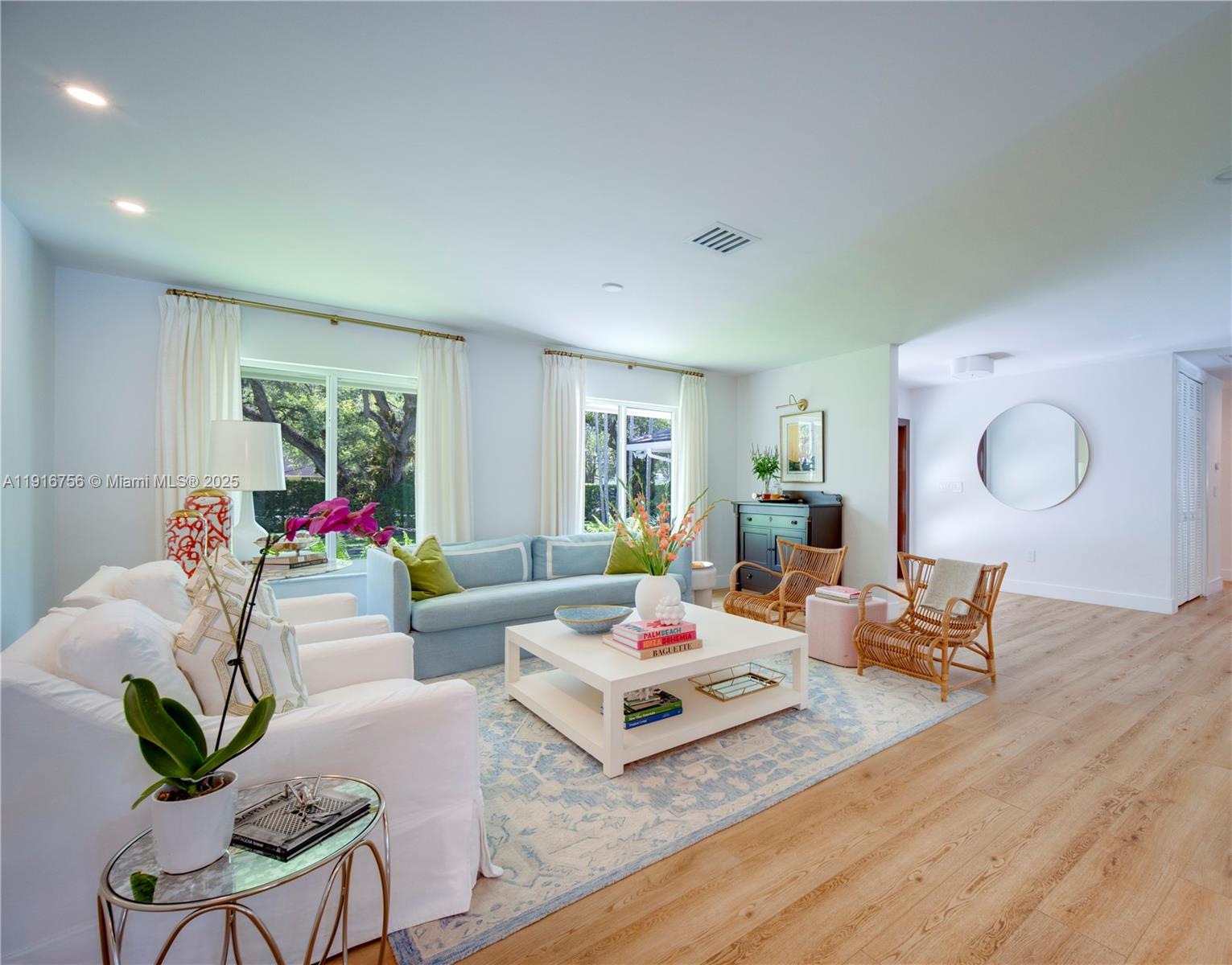11905 Southwest 67th Avenue Pinecrest, FL 33156 - Photo 16 of 33 a living room with furniture couches and a dining table with wooden floor