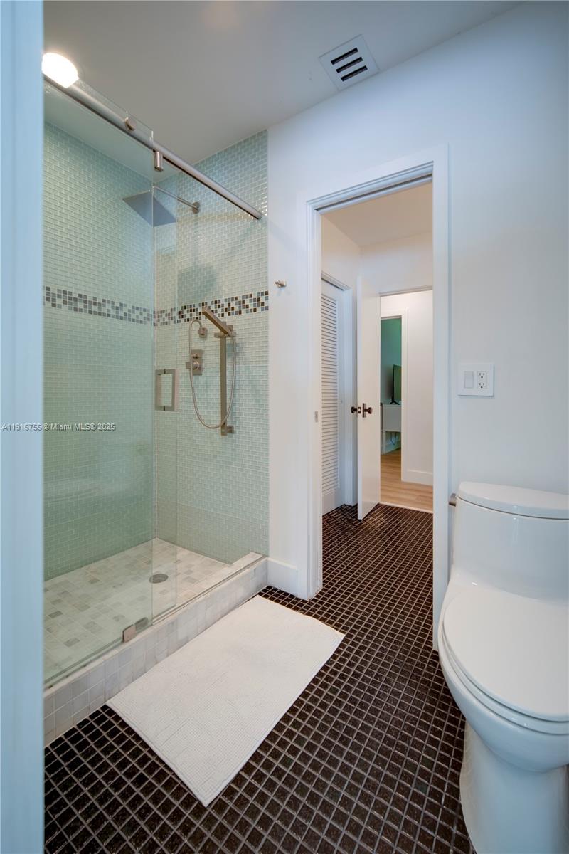 11905 Southwest 67th Avenue Pinecrest, FL 33156 - Photo 22 of 33 a bathroom with a sink and a shower