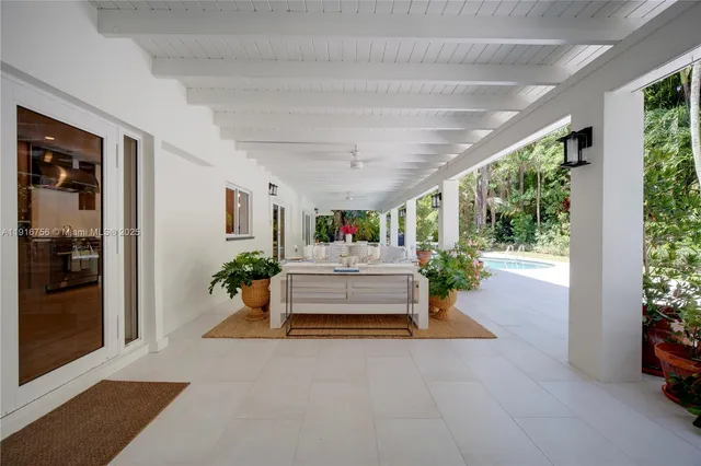 a living room with furniture and flat screen tv