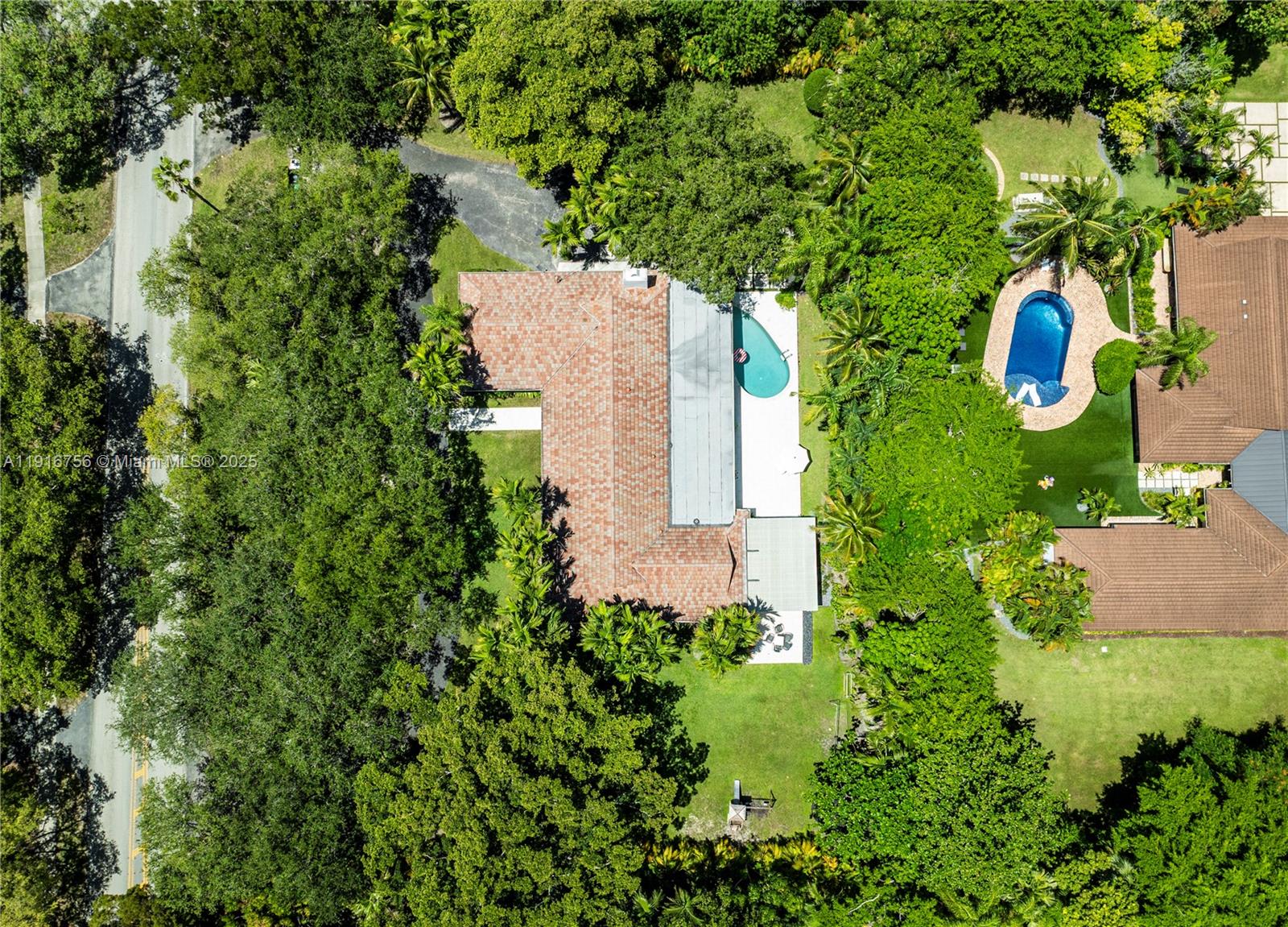 11905 Southwest 67th Avenue Pinecrest, FL 33156 - Photo 31 of 33 an aerial view of a house with a yard and garden