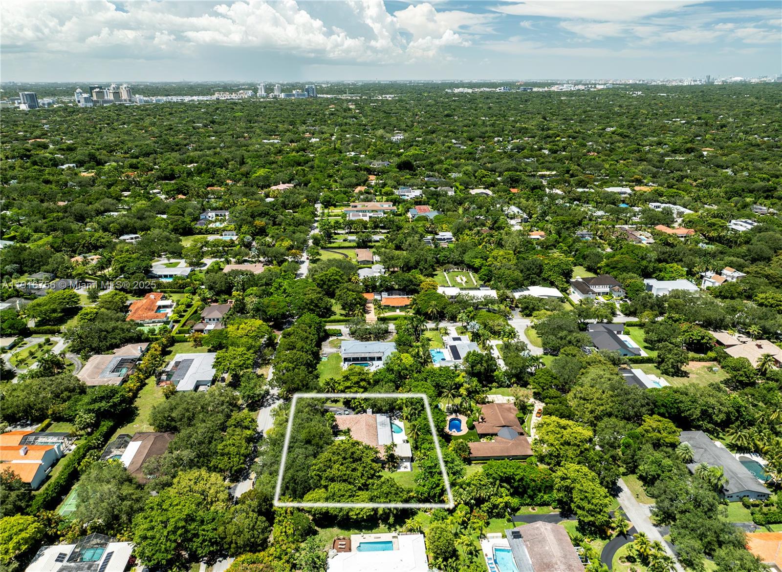 11905 Southwest 67th Avenue Pinecrest, FL 33156 - Photo 32 of 33 an aerial view of residential houses with outdoor space and trees