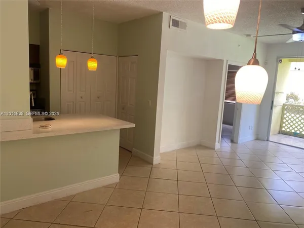 a view of a bathroom with sink and mirror