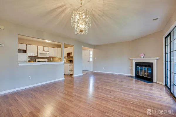 a view of a kitchen with an empty space and a window