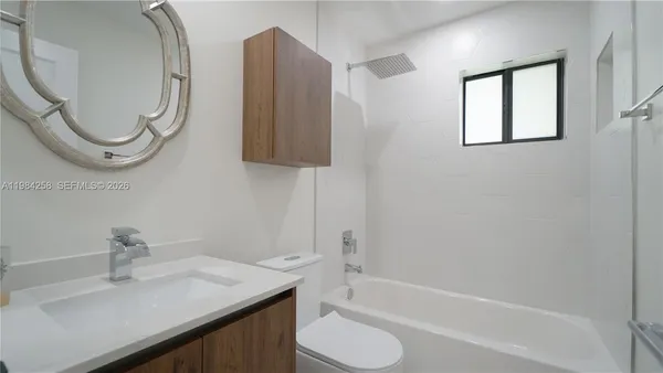 a view of a house with backyard and porch