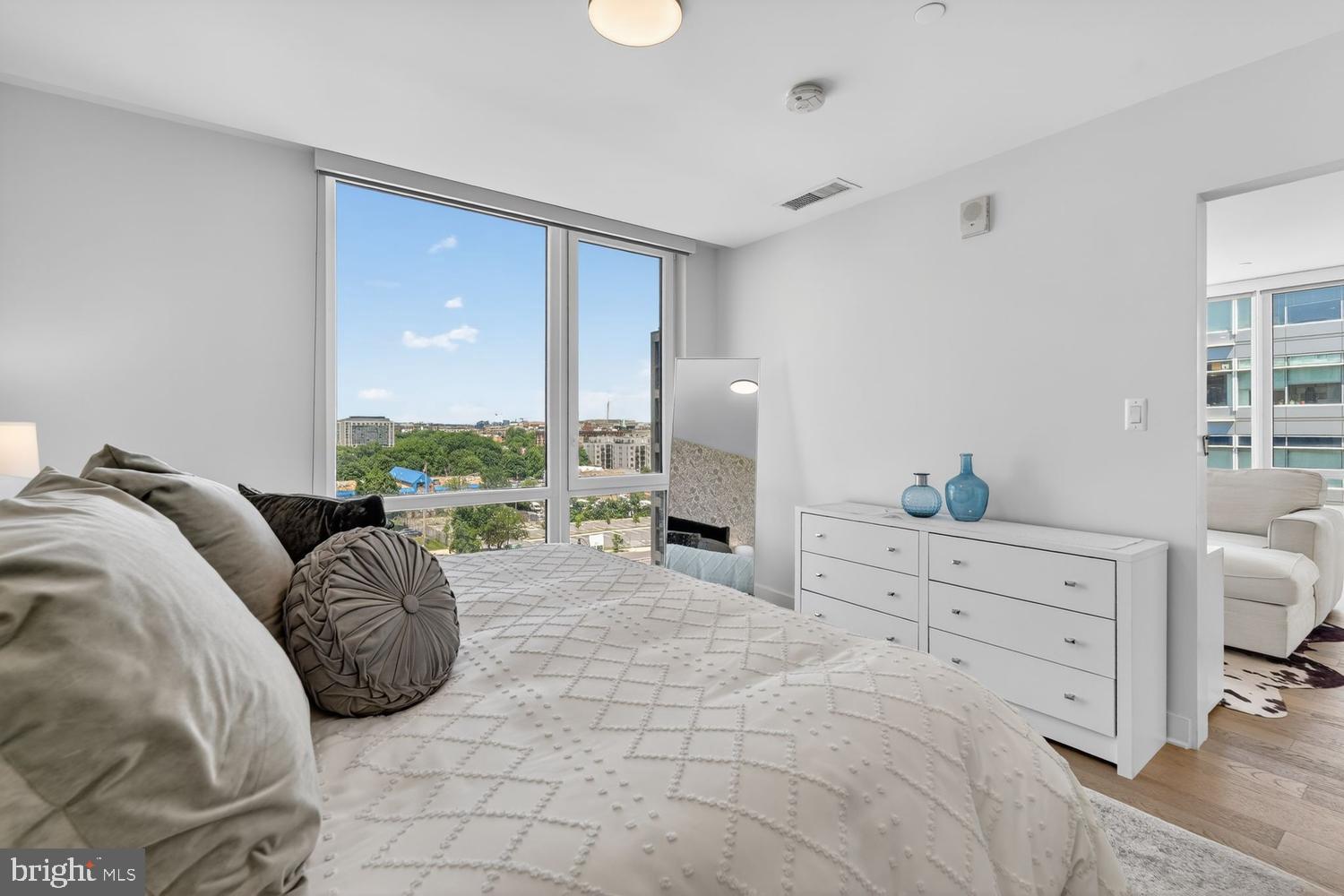 37 L Street Southeast, Unit 802 Washington, DC 20003 - Photo 9 of 23 a spacious bedroom with a large bed and a dresser