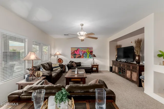 a kitchen with a sink a counter top space appliances and cabinets