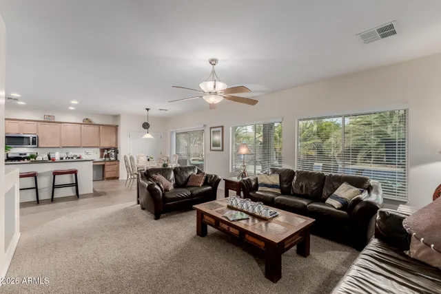 a kitchen with stainless steel appliances granite countertop a refrigerator sink and cabinets