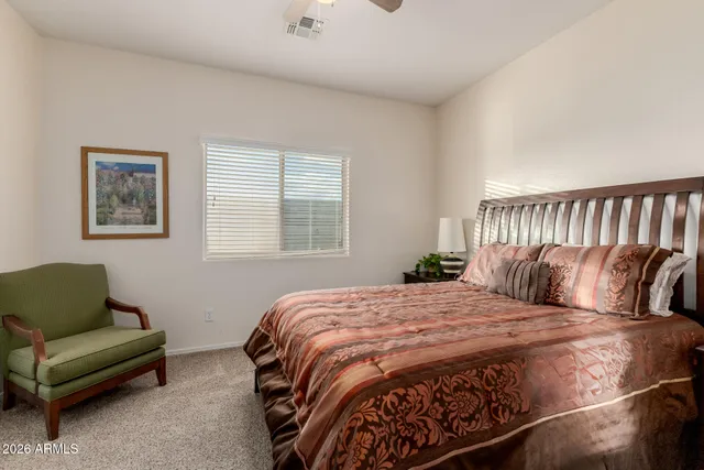 a room with pool table and a ceiling fan