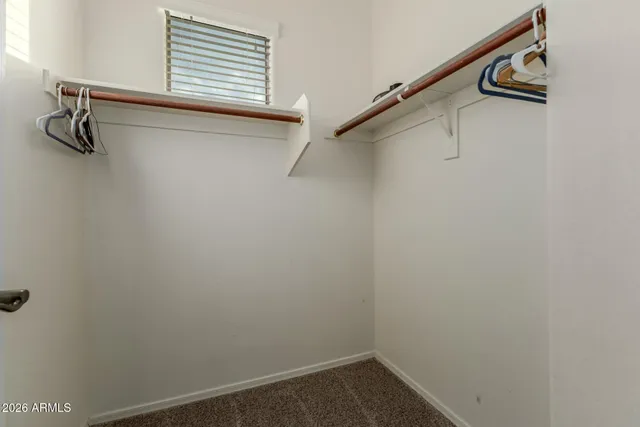 a view of a house with pool and chairs