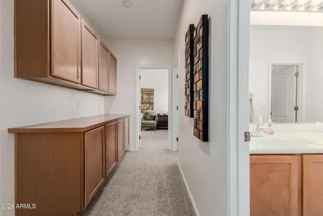 a view of a house with swimming pool and sitting area