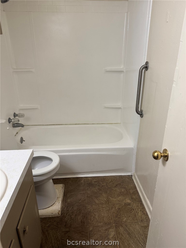 3180 Cain Road, Unit 171 College Station, TX 77845 - Photo 8 of 8 a bathroom with a toilet and a shower