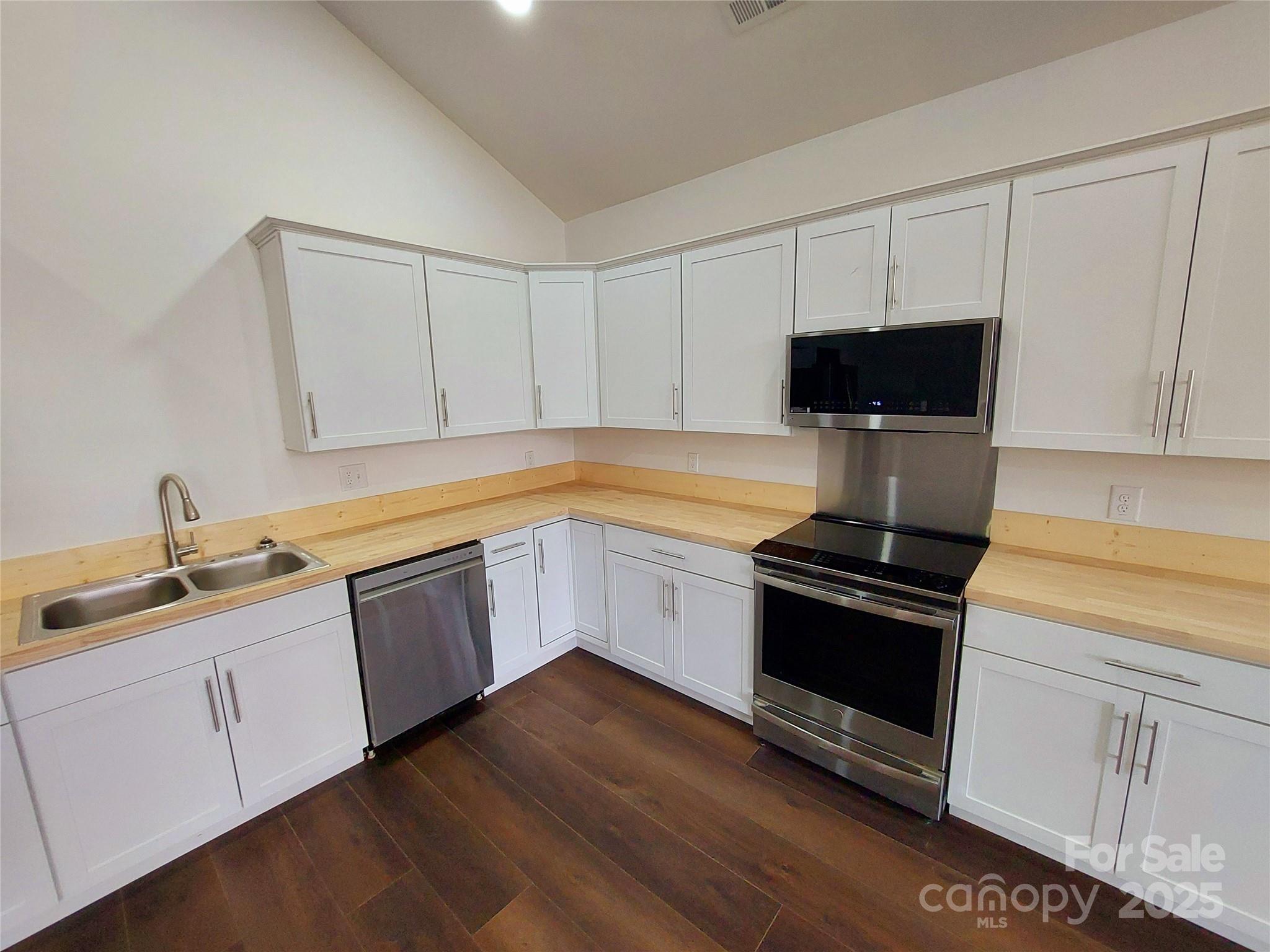 401 Constant Lane Columbus, NC 28722 - Photo 12 of 24 a kitchen with a sink and cabinets