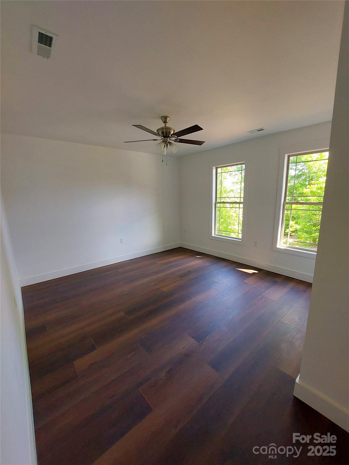 401 Constant Lane Columbus, NC 28722 - Photo 14 of 24 wooden floor in an empty room with a window