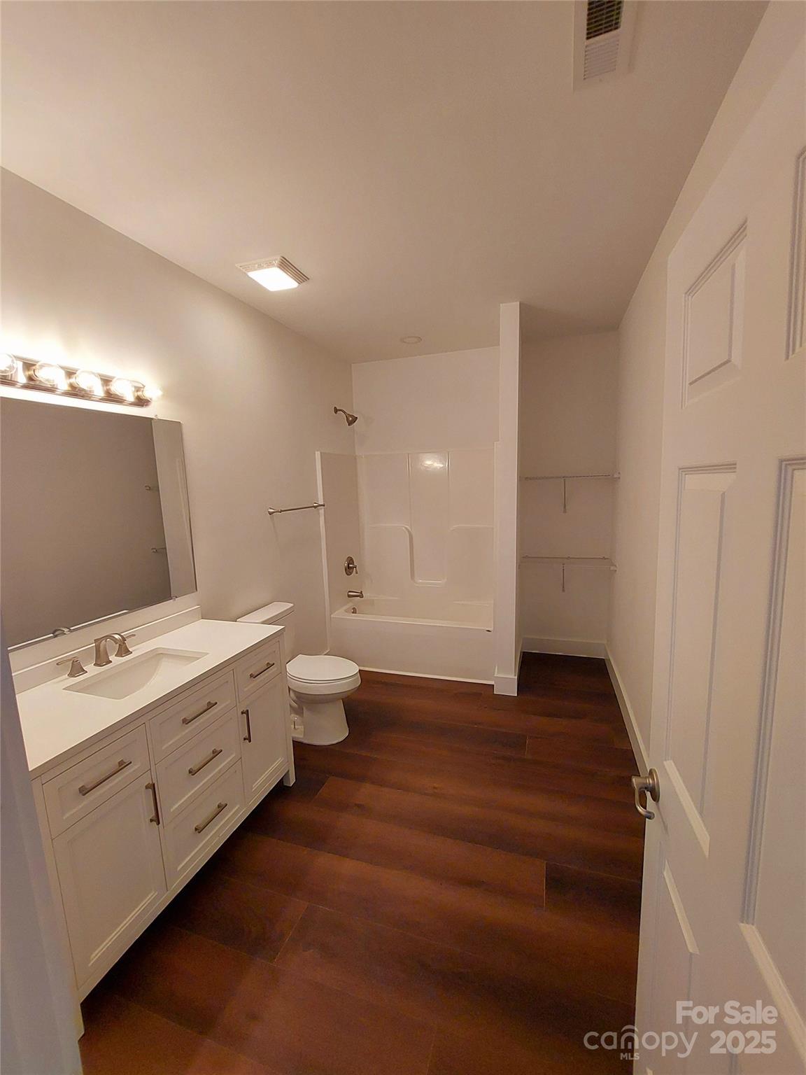 401 Constant Lane Columbus, NC 28722 - Photo 15 of 24 a bathroom with a sink a toilet and shower