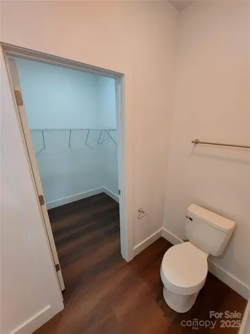 a bathroom with a toilet and a sink