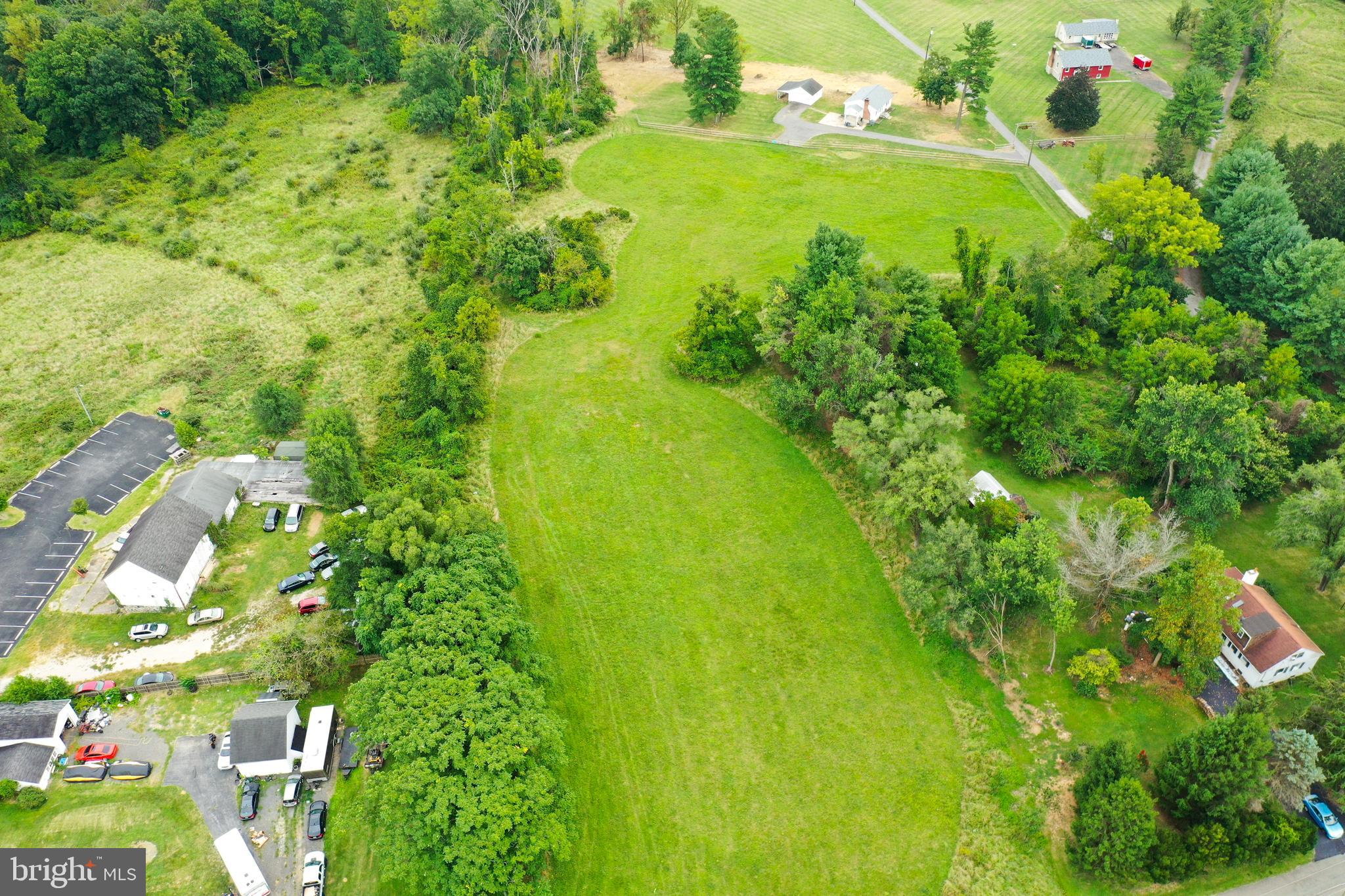 Rices Lane Windsor Mill, MD 21244 - Photo 19 of 22 a view of a big yard with lots of flower plants and wooden floor