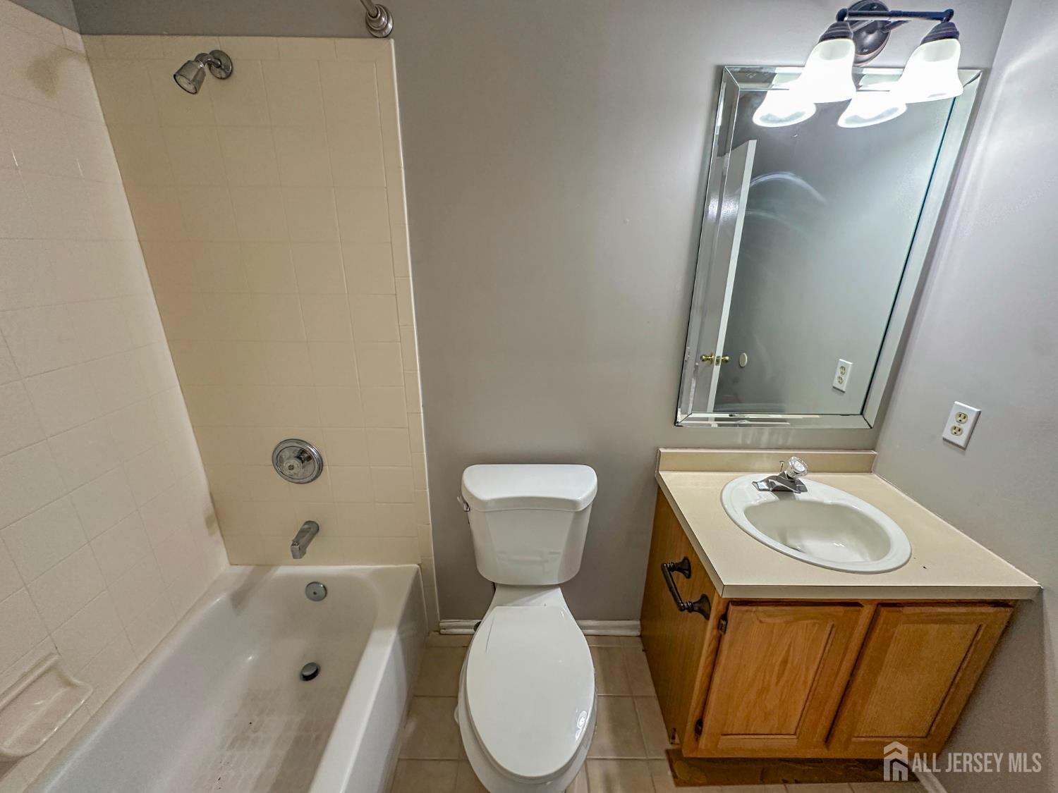 1212 Plymouth Road North Brunswick, NJ 08902 - Photo 19 of 27 a bathroom with a sink toilet and shower
