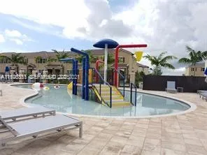a view of a swimming pool with a patio