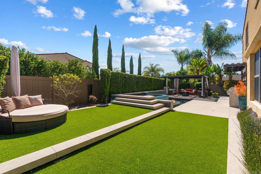 809 Dolphin Circle Encinitas, CA 92024 - Photo 4 of 71 a view of a patio with a table and chairs